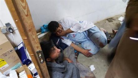 In this photo released by Medecins Sans Frontieres (MSF) on October 3, 2015, Afghan MSF staff are seen in one of the remaining parts of the MSF hospital in Kunduz, northern Afghanistan, after it was hit by a US airstrike. ©AFP